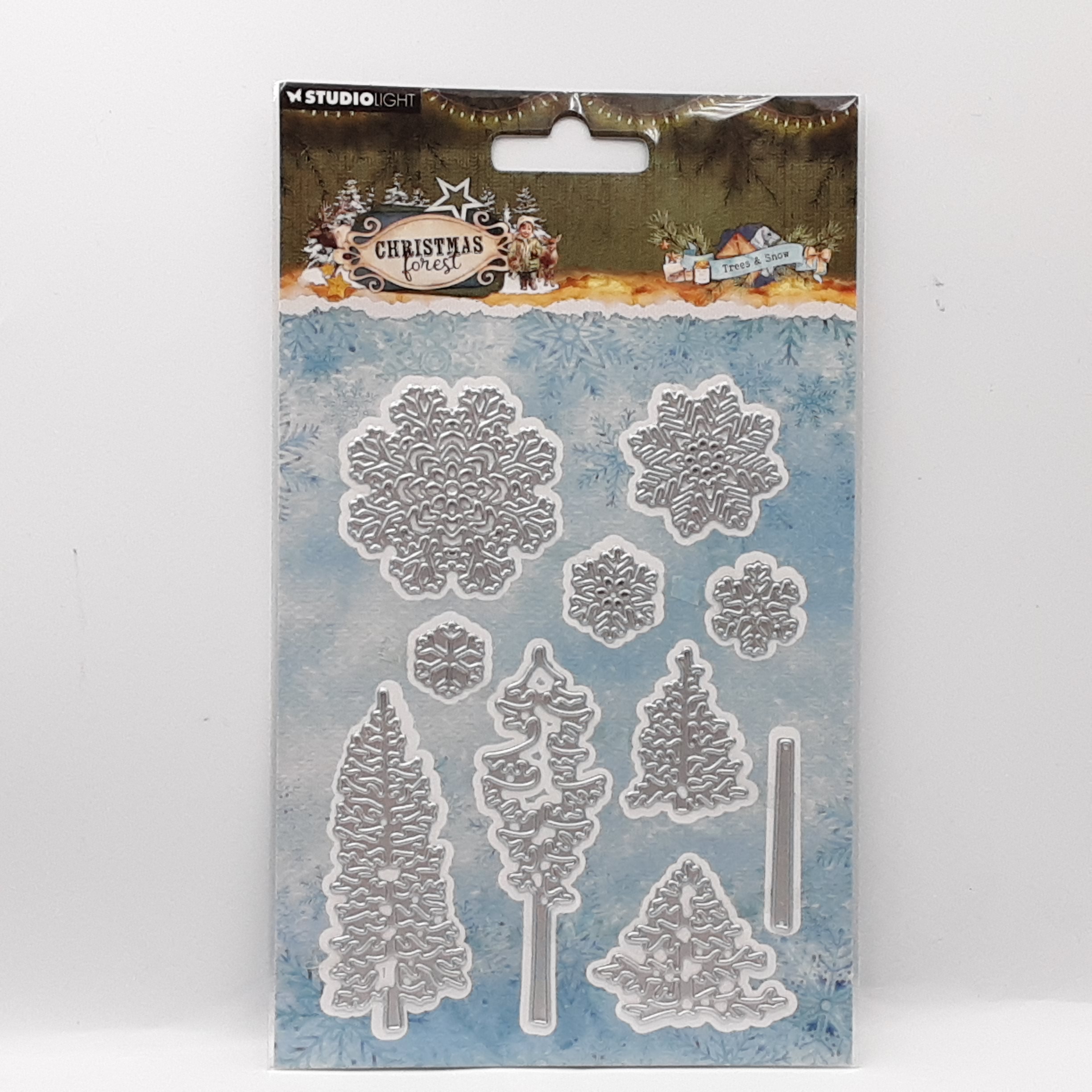 Christmas forest cutting dies trees and snow